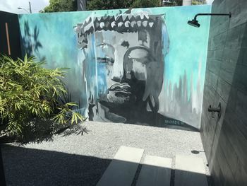 Panoramic shot of statue against wall