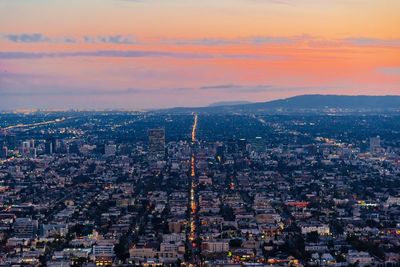 High angle view of city at sunset