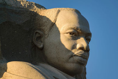 Low angle view of statue against sky