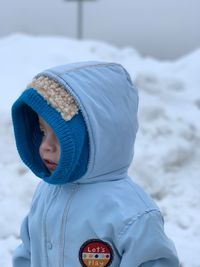 Cute boy wearing warm clothing during winter