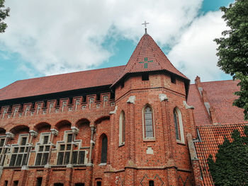 Historic building in gothic style against sky