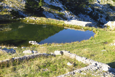 Scenic view of lake amidst rocks