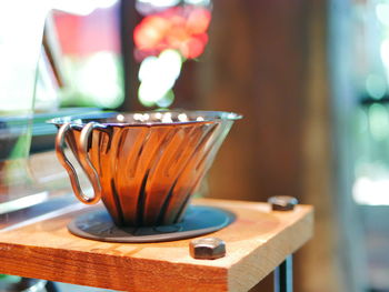 Close-up of coffee cup on table