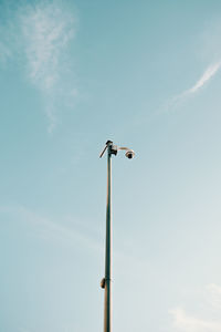 Low angle view of street light against sky