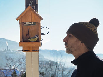 Side view portrait of young man during winter