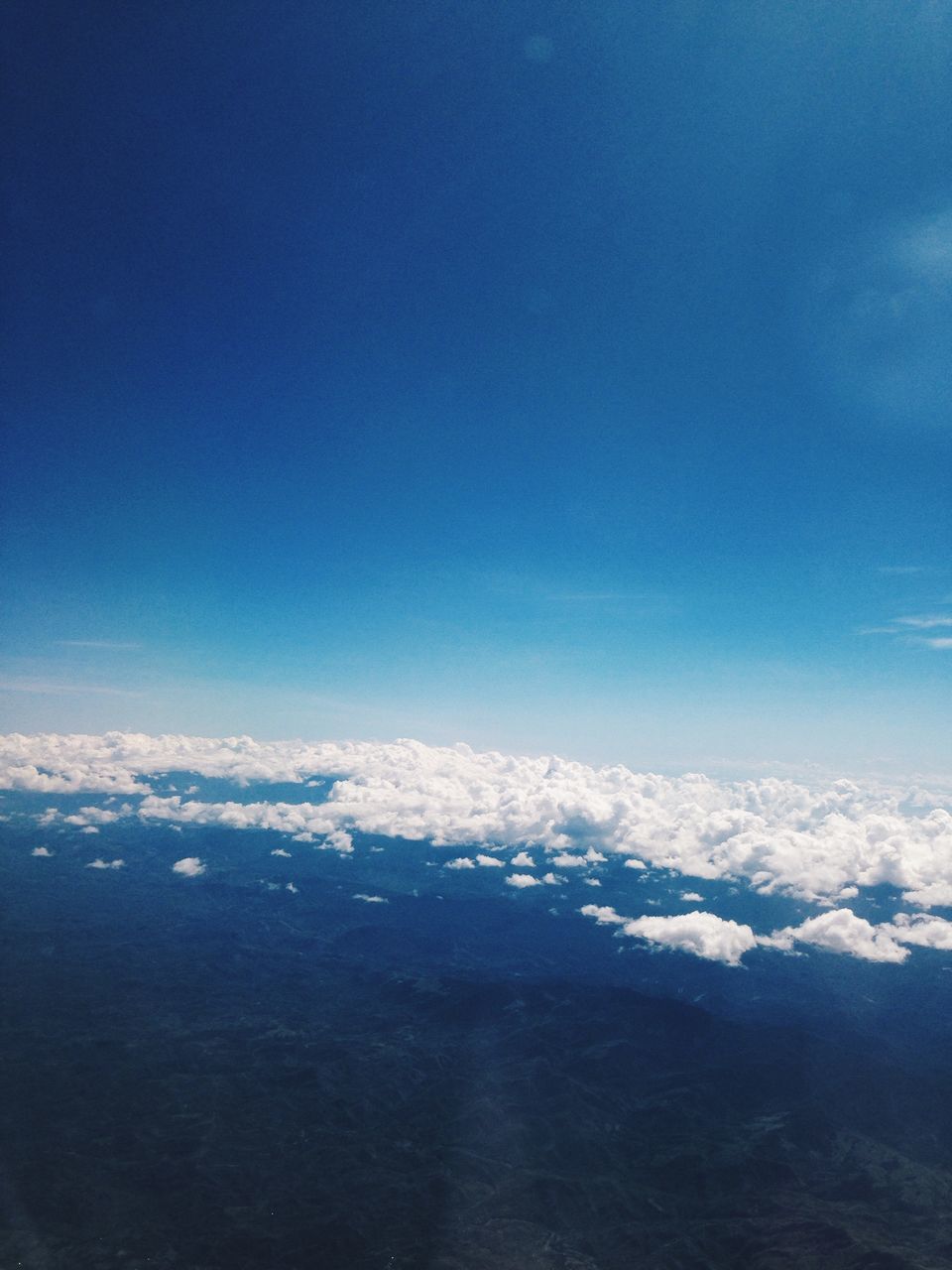blue, scenics, tranquil scene, beauty in nature, aerial view, cloudscape, tranquility, copy space, majestic, nature, sky, clear sky, idyllic, environment, cloud - sky, day, the natural world, cloud, sea, ethereal, vibrant color, atmosphere, outdoors, softness, dreamlike, distant, heaven, no people, above, non-urban scene