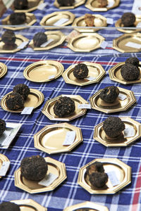 Black truffles in plates at market for sale