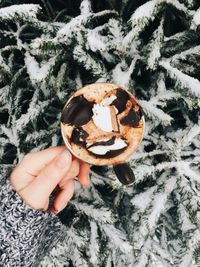 Close-up of hand holding ice cream