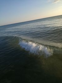 Scenic view of sea against sky at sunset