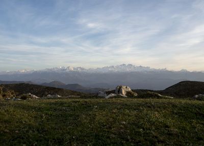 The sea behind, the mountains in front and over the field, my home.