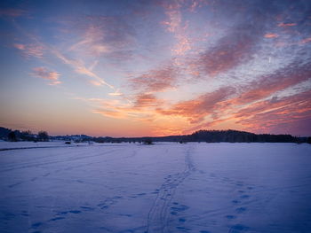 Scenic view of lake against sky during sunset