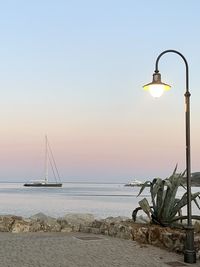 Scenic view of sea against clear sky during sunset