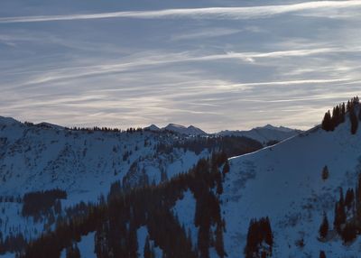 Panoramic view of snowcapped mountains against sky