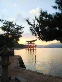 Scenic view of lake against sky during sunset
