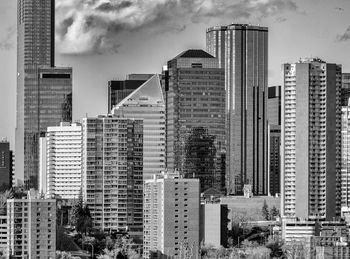 Modern buildings in city against sky