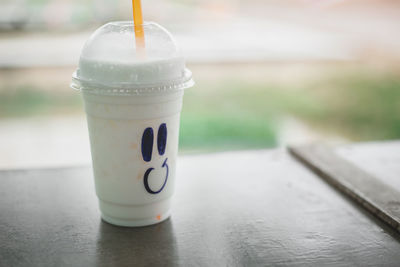 Close-up of coffee cup on table