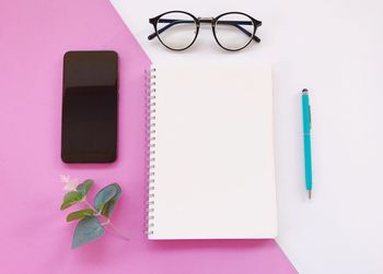 Directly above shot of pencil and book on table