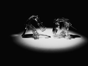 High angle view of drinking glass on table against black background