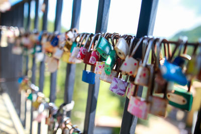 Close-up of padlocks hanging on metal