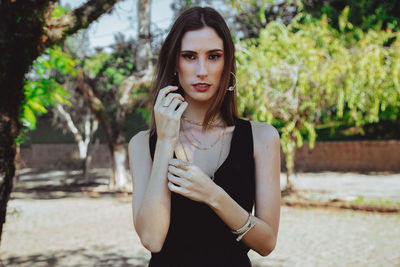 Portrait of young woman standing outdoors