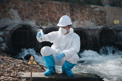 Rear view of man working at construction site