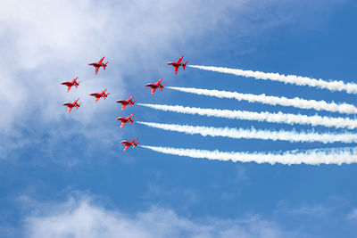 Low angle view of airshow against sky