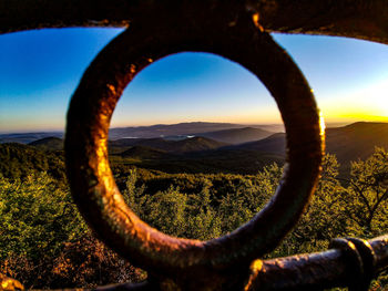 Close-up of land against clear sky during sunset