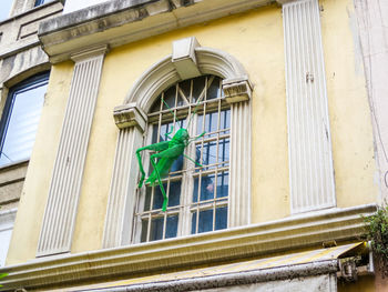 Low angle view of statue against building