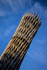 Low angle view of office building against blue sky