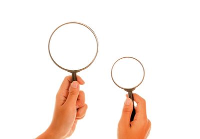 Midsection of person holding glass against white background