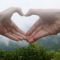 Close-up of man touching grass
