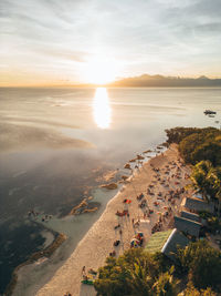 High angle view of beach against sky during sunset