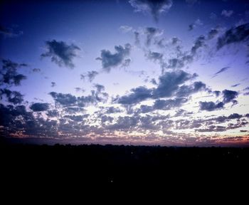 Silhouette landscape against sky during sunset