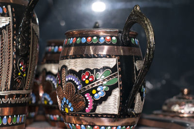 Close-up of antique container at market stall