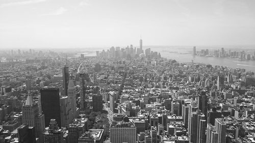 High angle view of modern buildings in city against sky