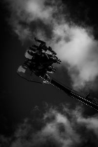 Low angle view of ferris wheel against sky