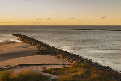 Scenic view of sea against sky at sunset