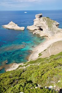 High angle view of sea shore against sky