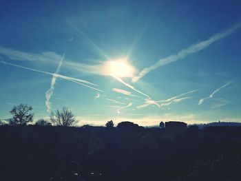Low angle view of vapor trails in sky