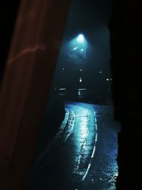 Illuminated street lights in building at night