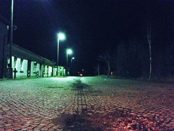 Illuminated street lights at night