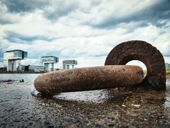 Close-up of rusty metal against sky