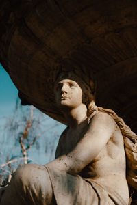 Low angle view of statue against sky