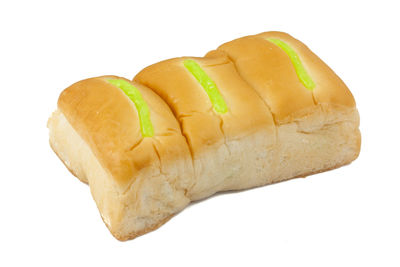 Close-up of bread against white background