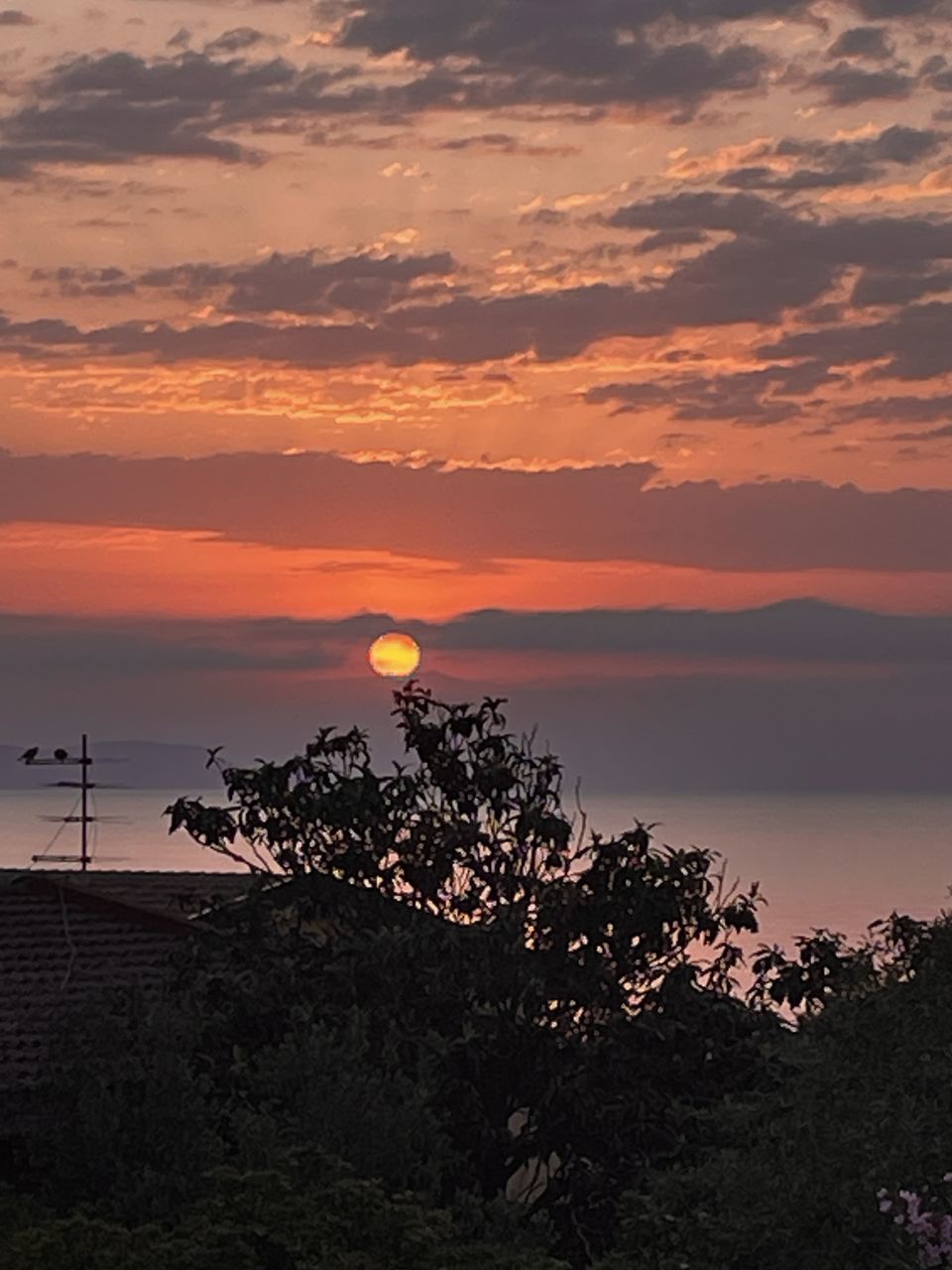 sky, sunset, horizon, beauty in nature, nature, cloud, scenics - nature, tree, dawn, plant, orange color, tranquility, no people, environment, silhouette, landscape, land, afterglow, sea, evening, outdoors, tranquil scene, water, sun, travel destinations, travel, dramatic sky, architecture, idyllic