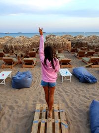 Rear view of woman on beach