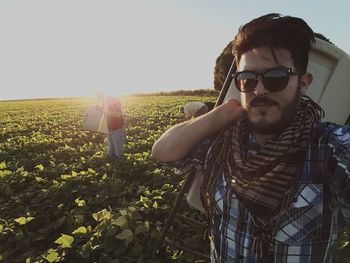 Portrait of man wearing sunglasses against sky