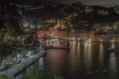 Illuminated buildings in city at night