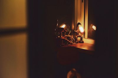 Close-up of illuminated lamp at home