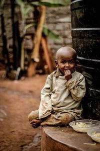 Portrait of a girl sitting outdoors